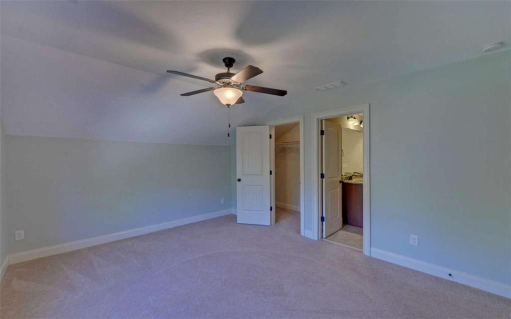 255 Abbington Way Clarkesville, GA 30523 - Photo 40 of 49 an empty room with a bathroom and a ceiling fan