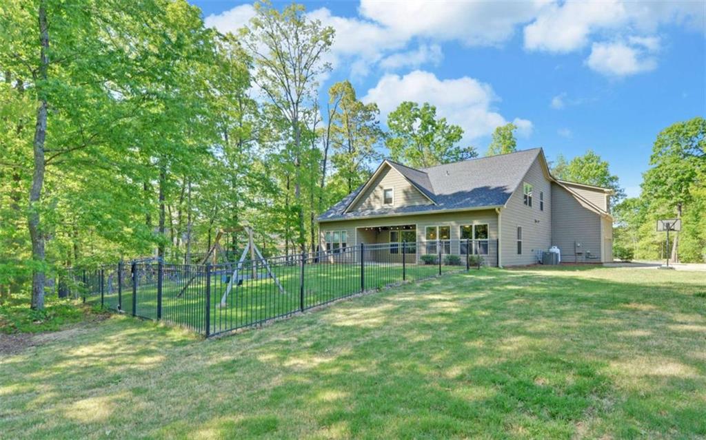 255 Abbington Way Clarkesville, GA 30523 - Photo 46 of 49 a view of a house with a yard and potted plants