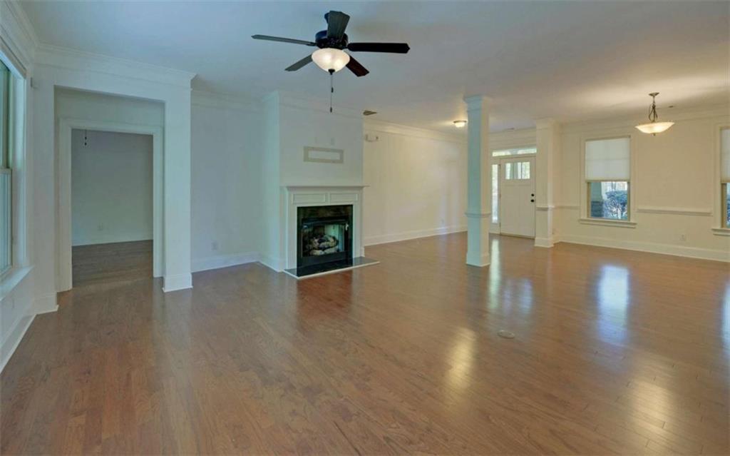 255 Abbington Way Clarkesville, GA 30523 - Photo 8 of 49 a view of empty room with wooden floor and fireplace