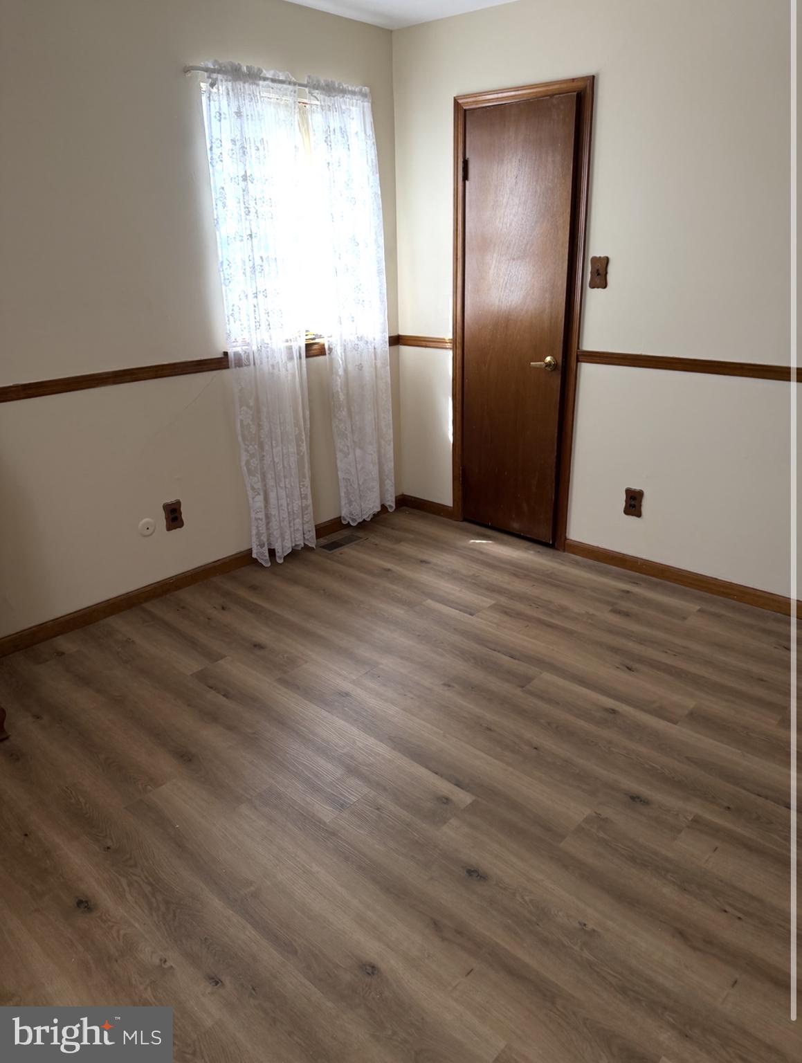12 Mallard Drive Tabernacle, NJ 08088 - Photo 15 of 31 a view of an empty room with wooden floor and a window