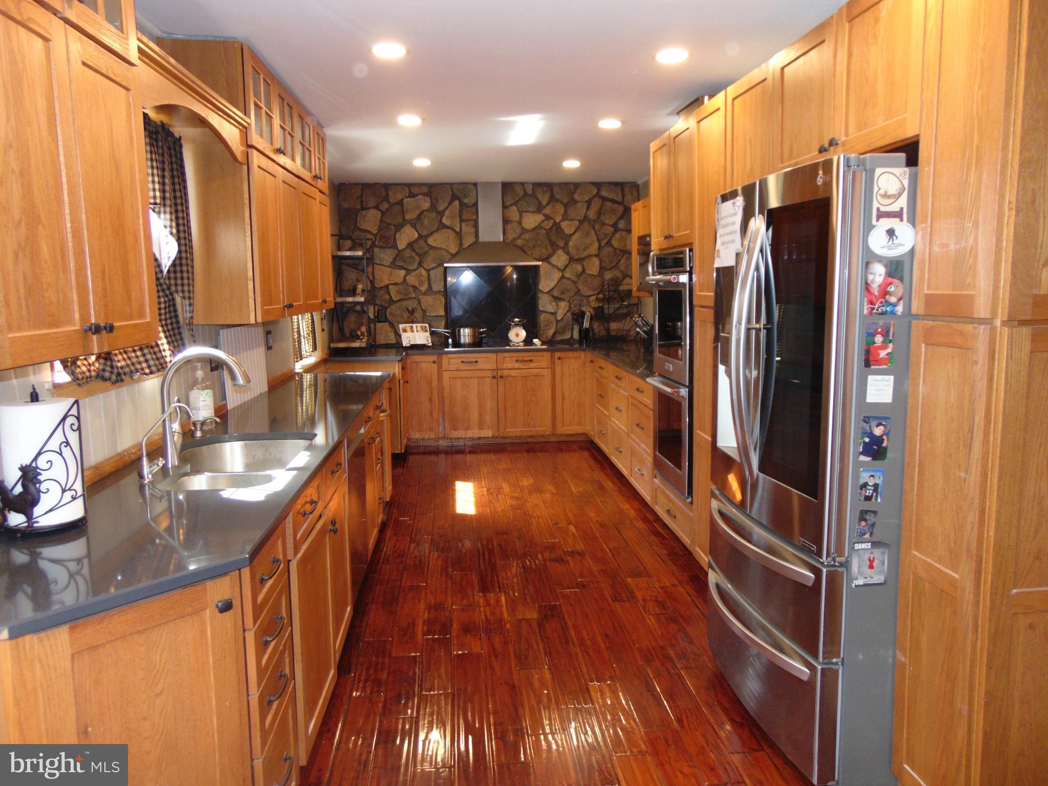 12 Mallard Drive Tabernacle, NJ 08088 - Photo 5 of 31 a view of a kitchen with a large kitchen island a large window a sink and a counter top space