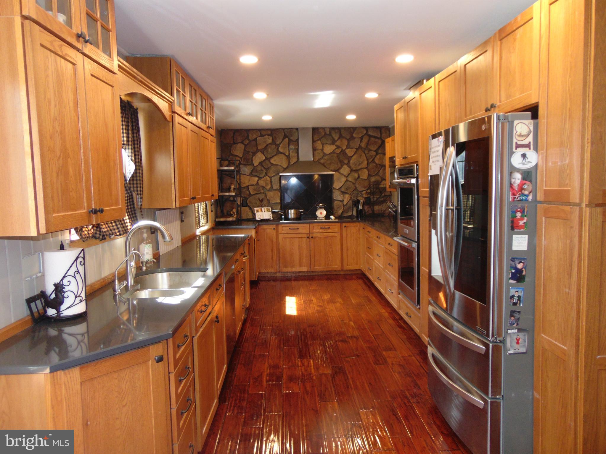 12 Mallard Drive Tabernacle, NJ 08088 - Photo 6 of 31 a kitchen with counter top space a sink a refrigerator and a window