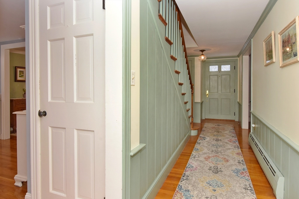 47 Sunrise Road Boxford, MA 01921 - Photo 3 of 42 a view of a hallway with wooden floor and staircase