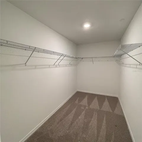 a view of a room with racks on the wall