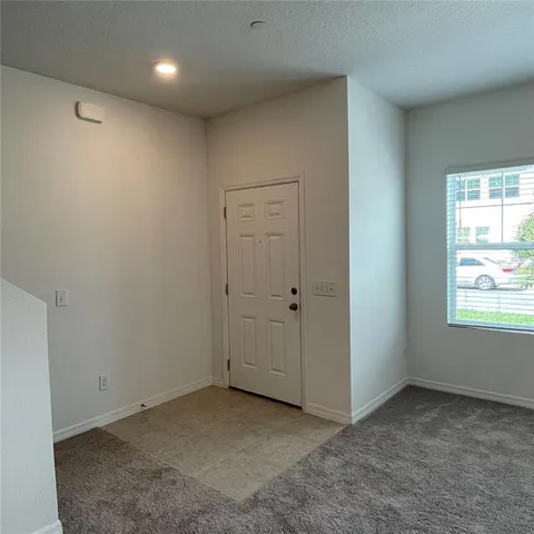 a view of an empty room and window