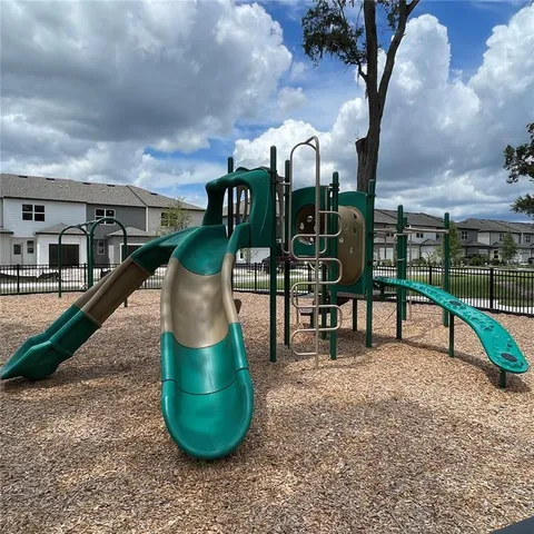 a view of a swimming pool and outdoor seating