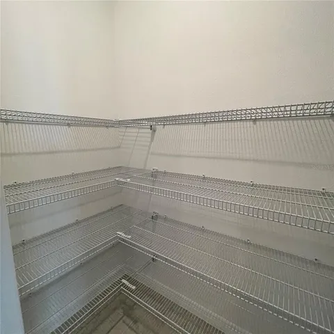 a view of a room with racks on the wall