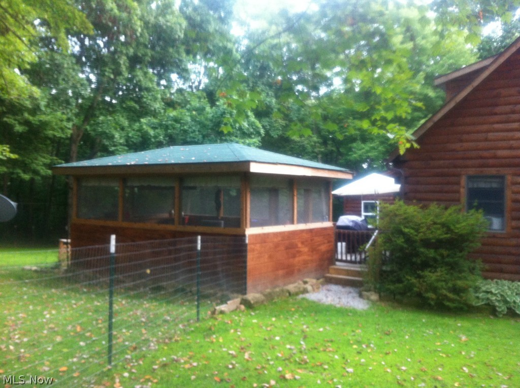 8097 Thomas Road Lisbon, OH 44432 - Photo 3 of 22 Screened porch with electric.
