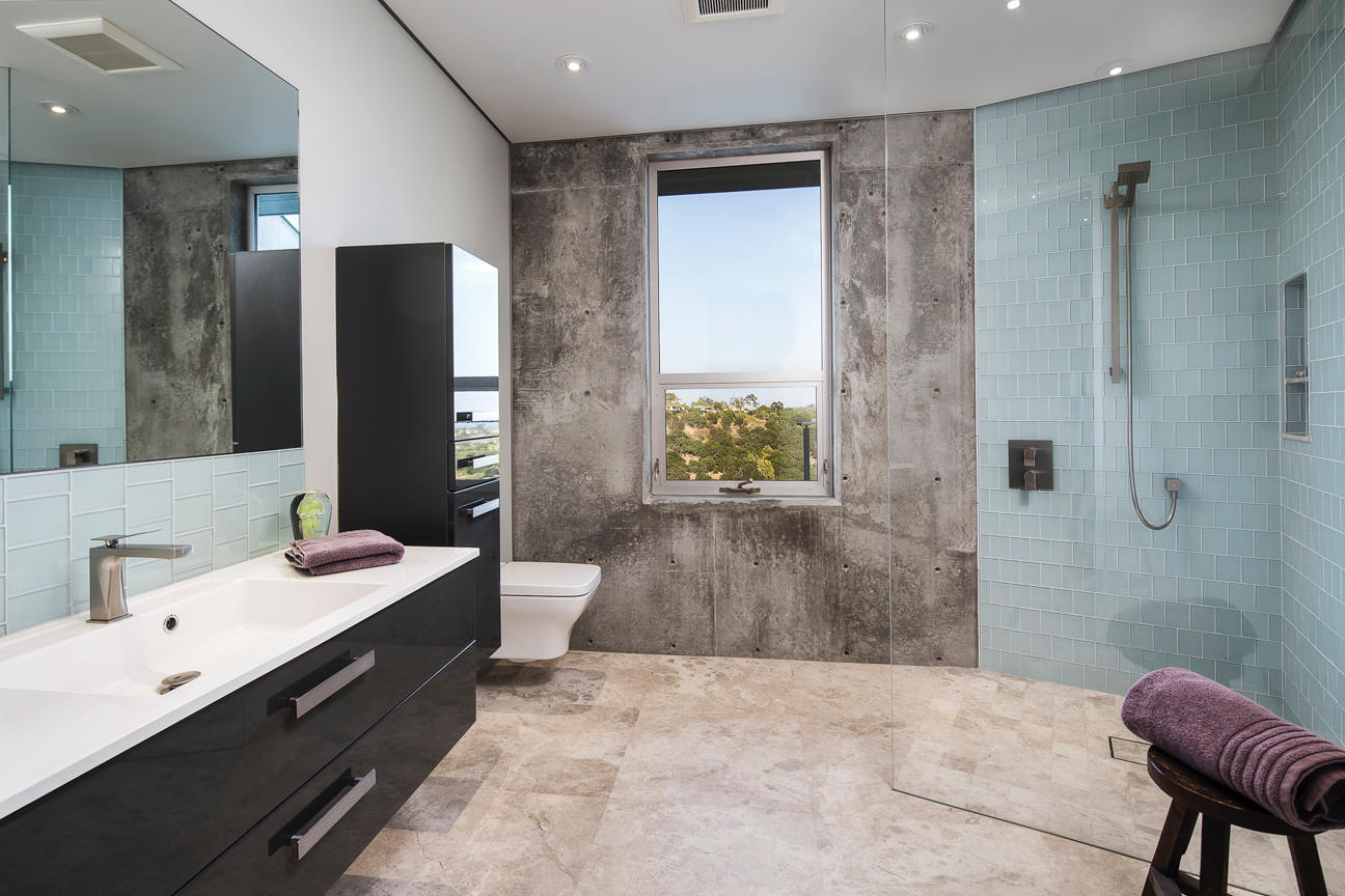 376 Las Alturas Road Santa Barbara, CA 93103 - Photo 24 of 36 a spacious bathroom with a granite countertop sink a toilet a mirror and shower