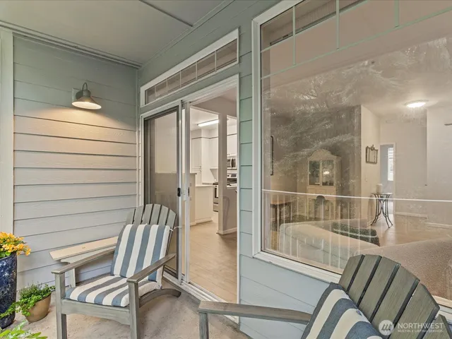 a living room with a fireplace and a view of living room