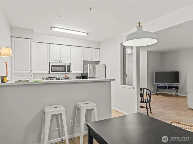 a view of a livingroom with furniture and a gate