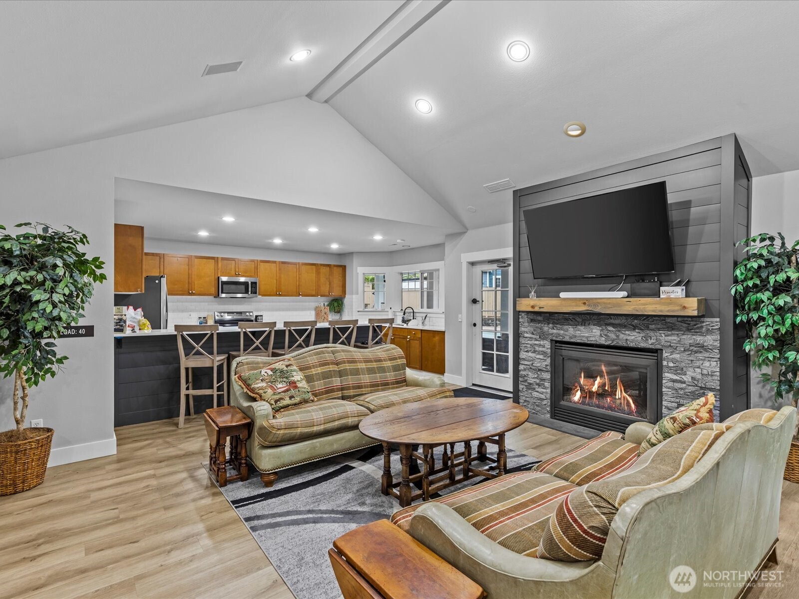 15150 140th Way Southeast, Unit P204 Renton, WA 98058 - Photo 23 of 28 a living room with furniture and a fireplace