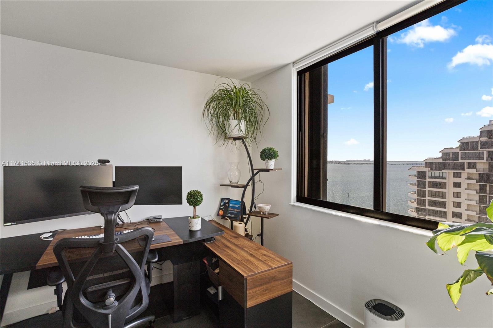 540 Brickell Key Drive, Unit 1519 Miami, FL 33131 - Photo 29 of 48 a view of a workspace with furniture