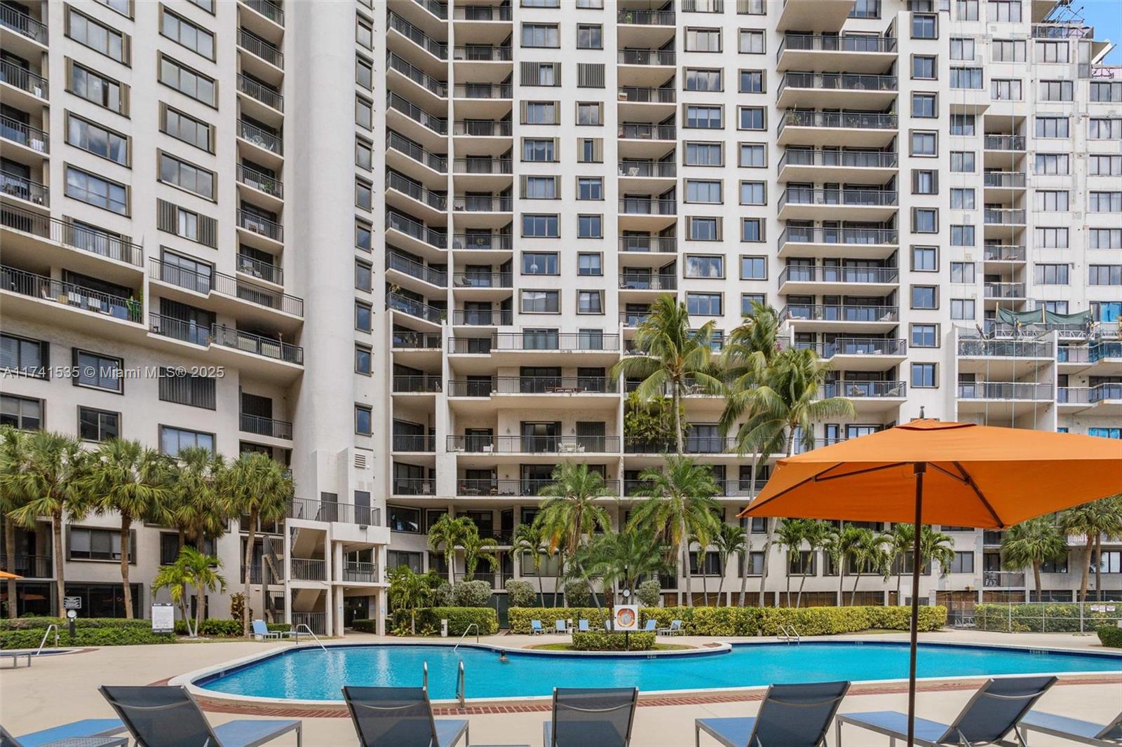 540 Brickell Key Drive, Unit 1519 Miami, FL 33131 - Photo 32 of 48 a view of pool with a backyard and balcony