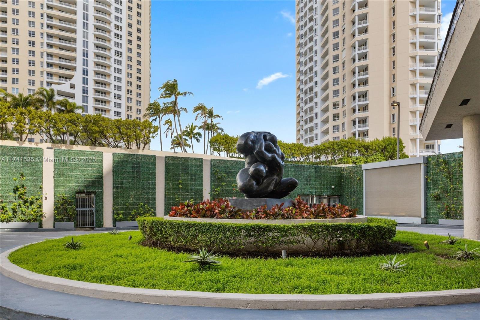 540 Brickell Key Drive, Unit 1519 Miami, FL 33131 - Photo 39 of 48 a front view of a house with a yard