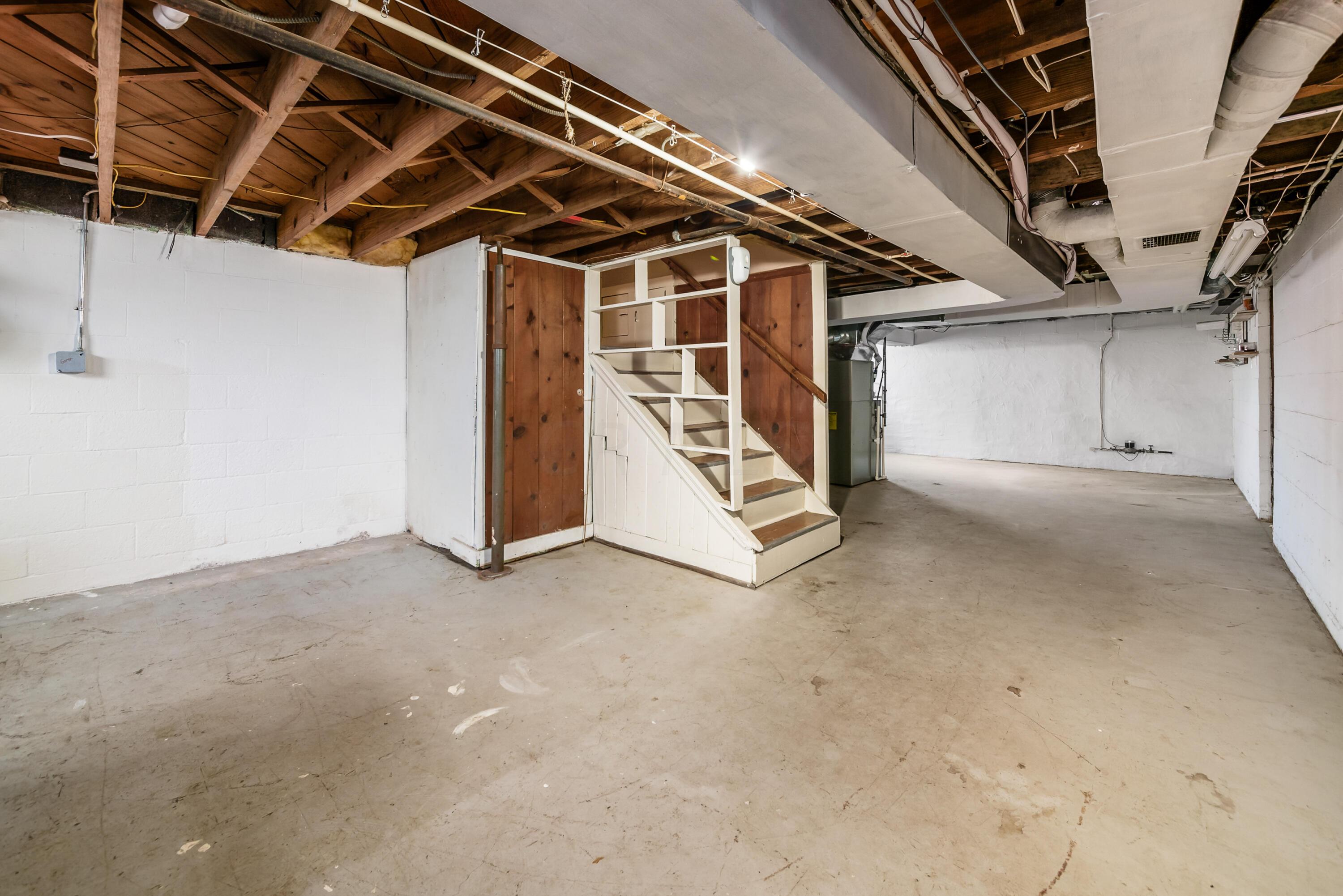 119 South James Road Columbus, OH 43213 - Photo 35 of 54 BIG spacious basement includes laundry area, work space area, what could be a rec room, plus LARGE pantry space and also a grow/seed starter space