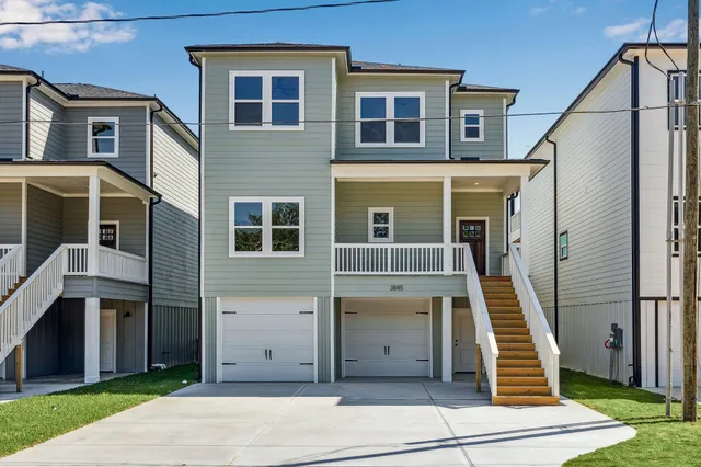 a front view of a house with wooden stairs