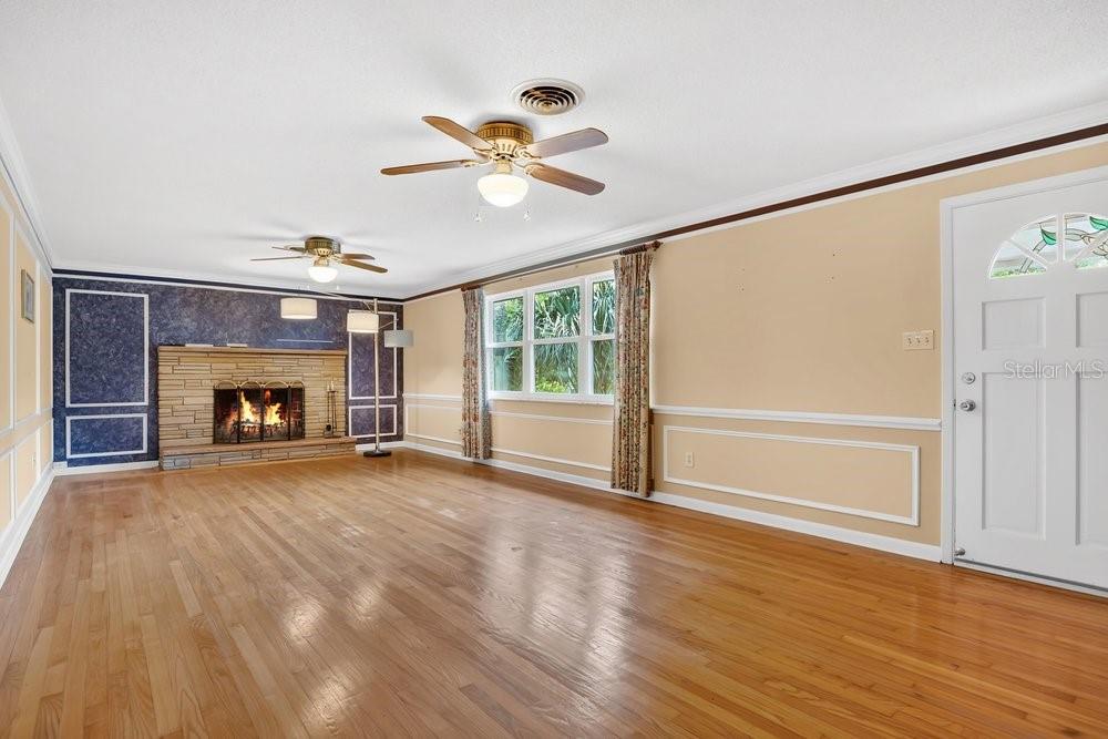 5137 Mt Plymouth Road Apopka, FL 32712 - Photo 13 of 58 a view of an empty room with a window and fireplace