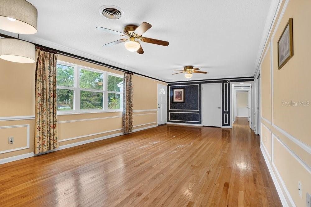 5137 Mt Plymouth Road Apopka, FL 32712 - Photo 15 of 58 wooden floor in an empty room with a window