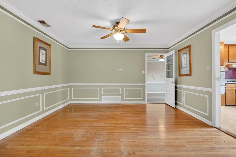 5137 Mt Plymouth Road Apopka, FL 32712 - Photo 16 of 58 a view of an empty room with wooden floor and a window