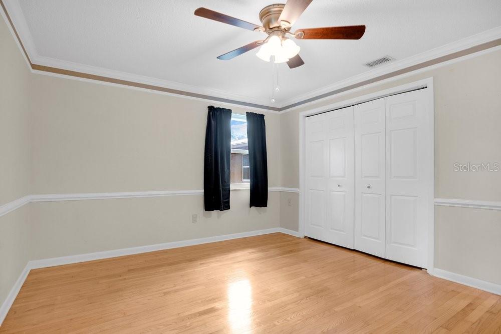 5137 Mt Plymouth Road Apopka, FL 32712 - Photo 20 of 58 an empty room with a ceiling fan and fan