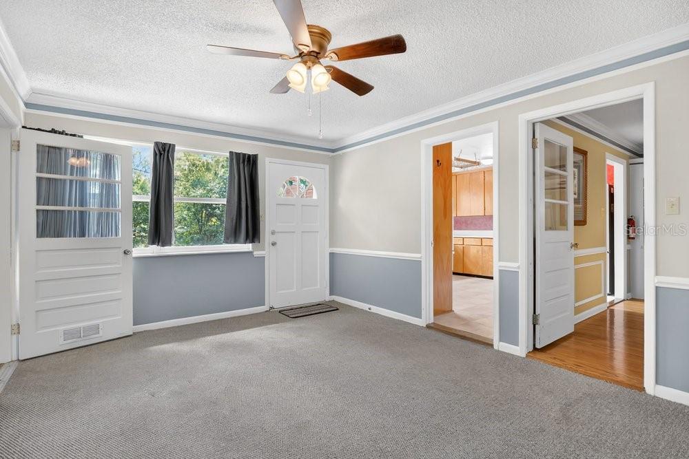 5137 Mt Plymouth Road Apopka, FL 32712 - Photo 26 of 58 wooden floor and windows in an empty room