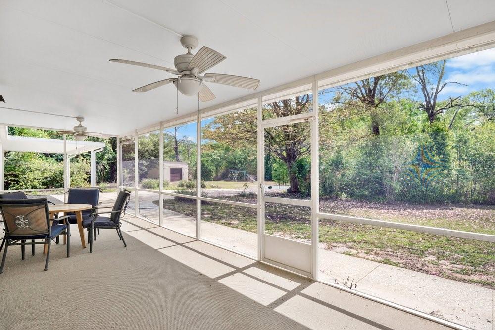 5137 Mt Plymouth Road Apopka, FL 32712 - Photo 29 of 58 a view of a porch with furniture and yard