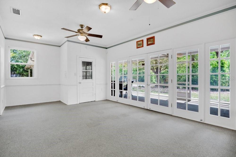 5137 Mt Plymouth Road Apopka, FL 32712 - Photo 31 of 58 a view of an empty room with a window and a ceiling fan