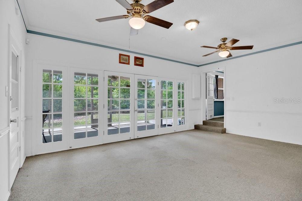 5137 Mt Plymouth Road Apopka, FL 32712 - Photo 34 of 58 a view of an empty room with a ceiling fan and window