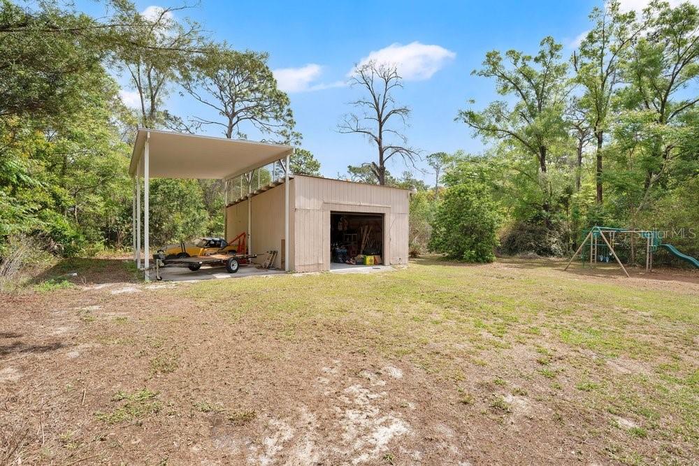 5137 Mt Plymouth Road Apopka, FL 32712 - Photo 37 of 58 a view of a house with backyard and a tree