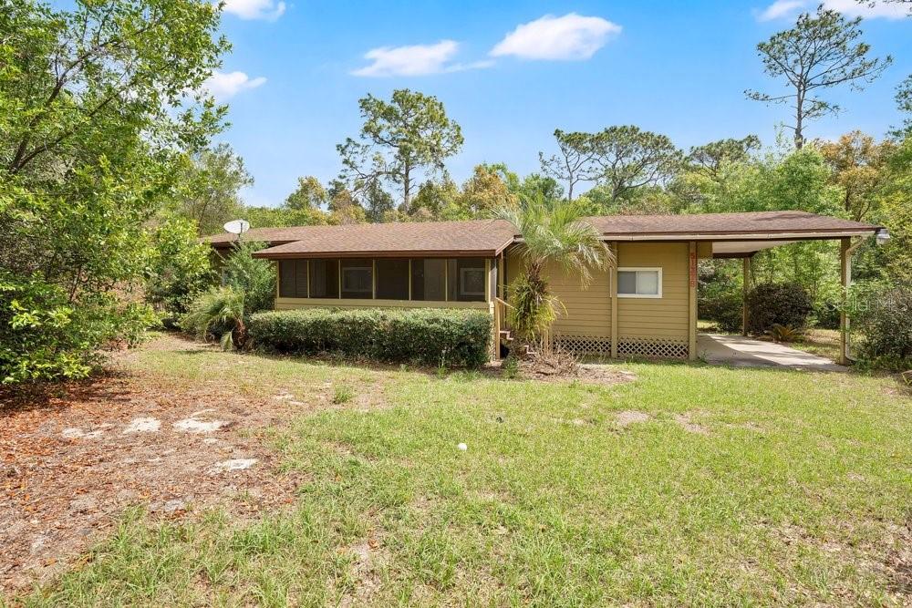 5137 Mt Plymouth Road Apopka, FL 32712 - Photo 38 of 58 a front view of house with yard and green space