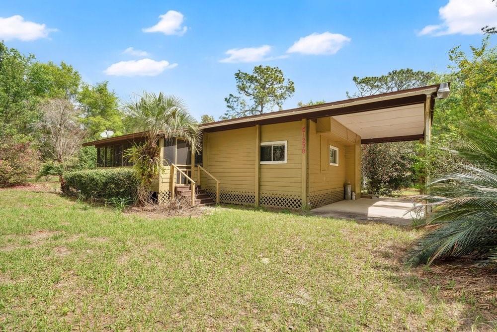 5137 Mt Plymouth Road Apopka, FL 32712 - Photo 39 of 58 a view of a house with a yard