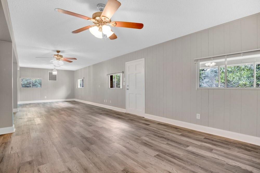 5137 Mt Plymouth Road Apopka, FL 32712 - Photo 42 of 58 a view of an empty room with window and wooden floor