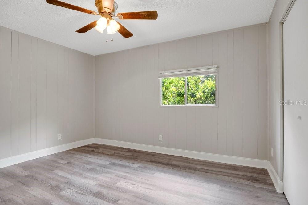 5137 Mt Plymouth Road Apopka, FL 32712 - Photo 43 of 58 an empty room with a window and a fan