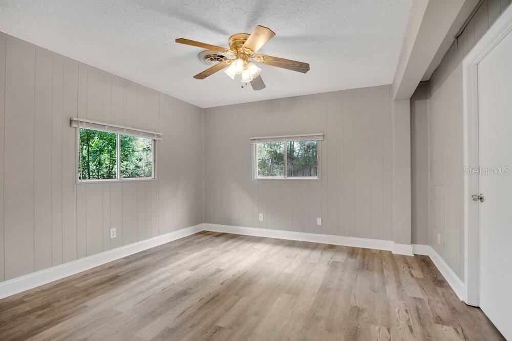 5137 Mt Plymouth Road Apopka, FL 32712 - Photo 45 of 58 a view of an empty room with window and wooden floor
