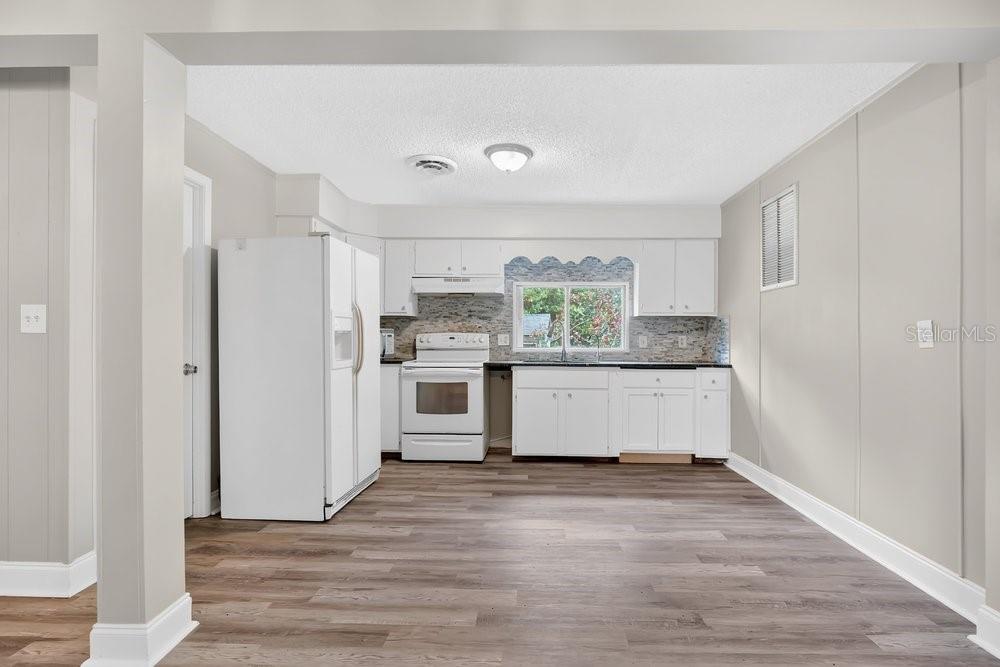 5137 Mt Plymouth Road Apopka, FL 32712 - Photo 47 of 58 a kitchen with stainless steel appliances a refrigerator and microwave