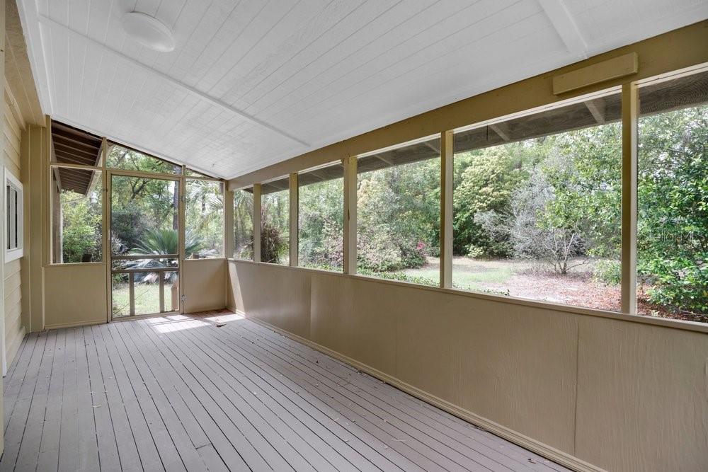 5137 Mt Plymouth Road Apopka, FL 32712 - Photo 50 of 58 a view of a room with wooden floor and outdoor space