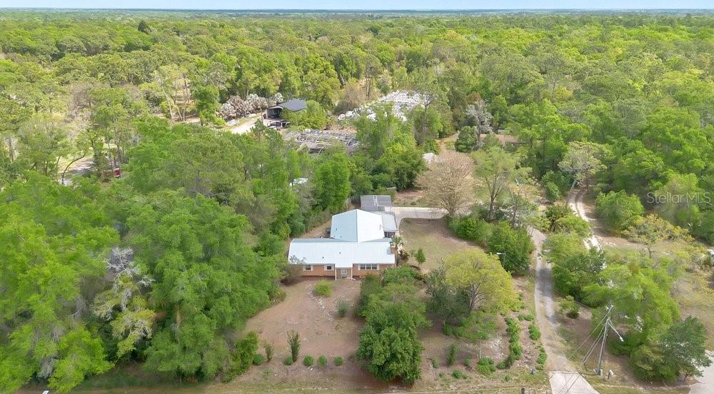 5137 Mt Plymouth Road Apopka, FL 32712 - Photo 56 of 58 an aerial view of residential house with outdoor space and trees all around