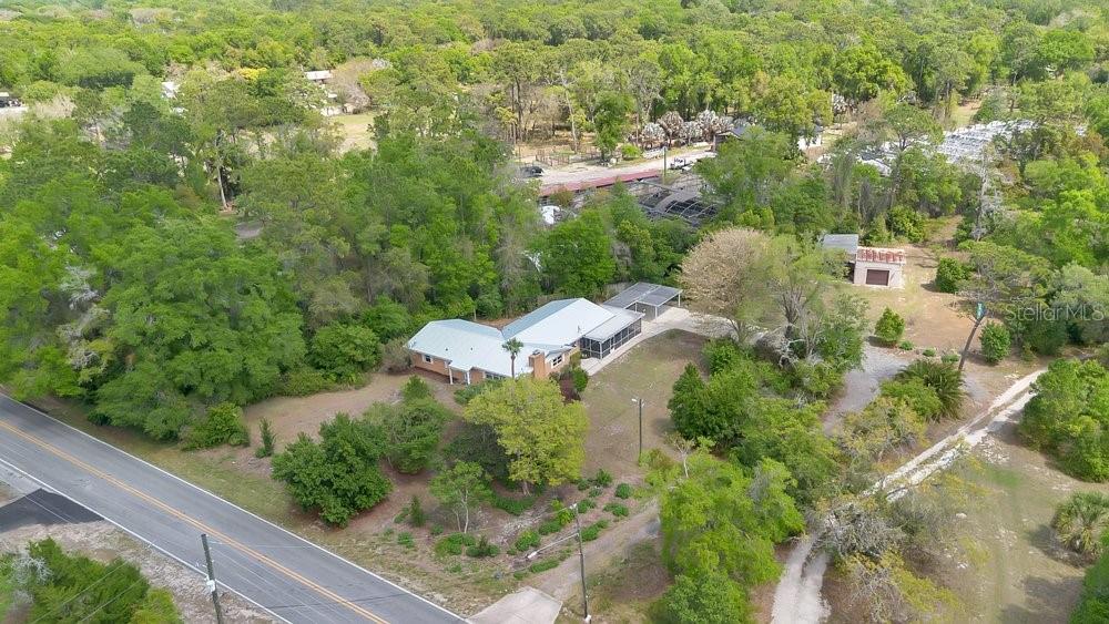 5137 Mt Plymouth Road Apopka, FL 32712 - Photo 57 of 58 an aerial view of residential house with outdoor space and trees all around