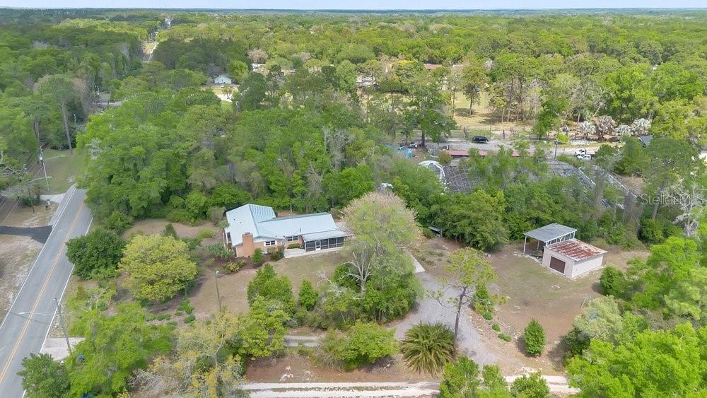 5137 Mt Plymouth Road Apopka, FL 32712 - Photo 58 of 58 an aerial view of residential house with outdoor space and trees all around