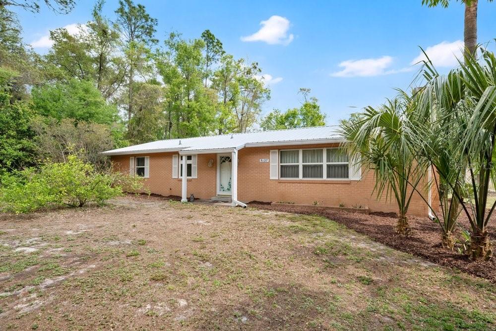 5137 Mt Plymouth Road Apopka, FL 32712 - Photo 8 of 58 a view of a house with a backyard