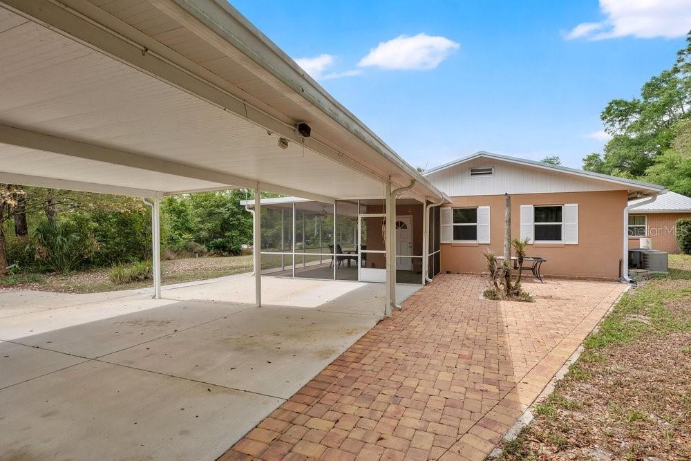5137 Mt Plymouth Road Apopka, FL 32712 - Photo 9 of 58 a backyard of a house with basket ball court and porch