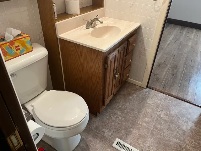 a bathroom with a sink and a toilet
