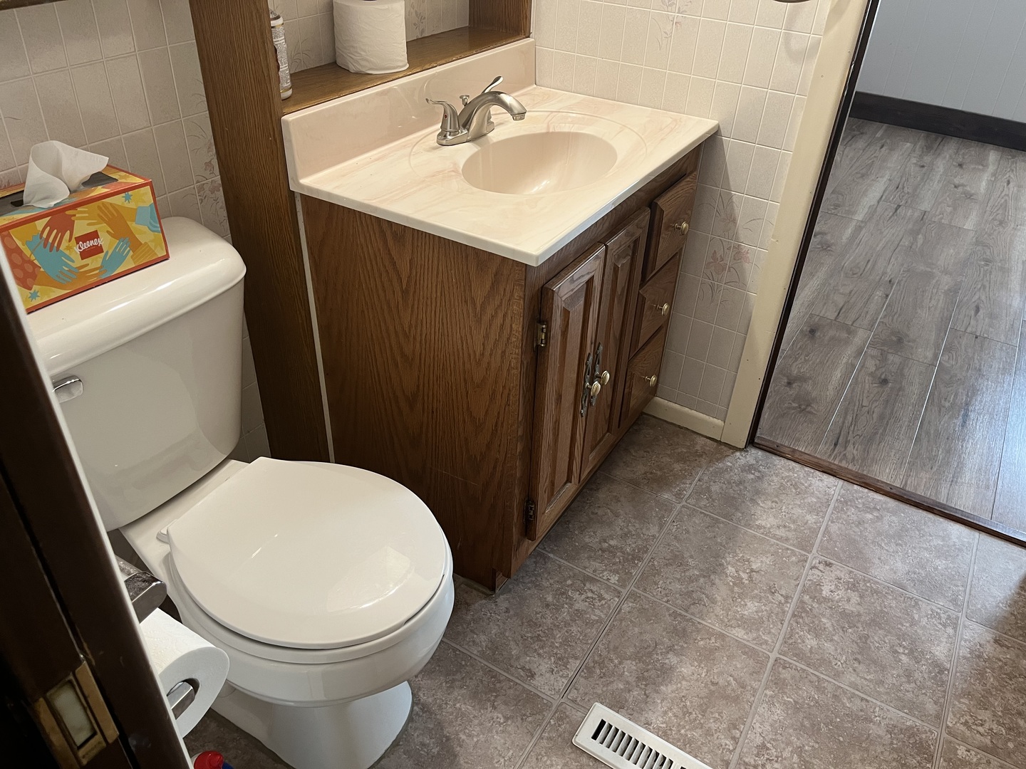 112 Chicago Road, Unit 1 Oswego, IL 60543 - Photo 15 of 29 a bathroom with a sink and a toilet