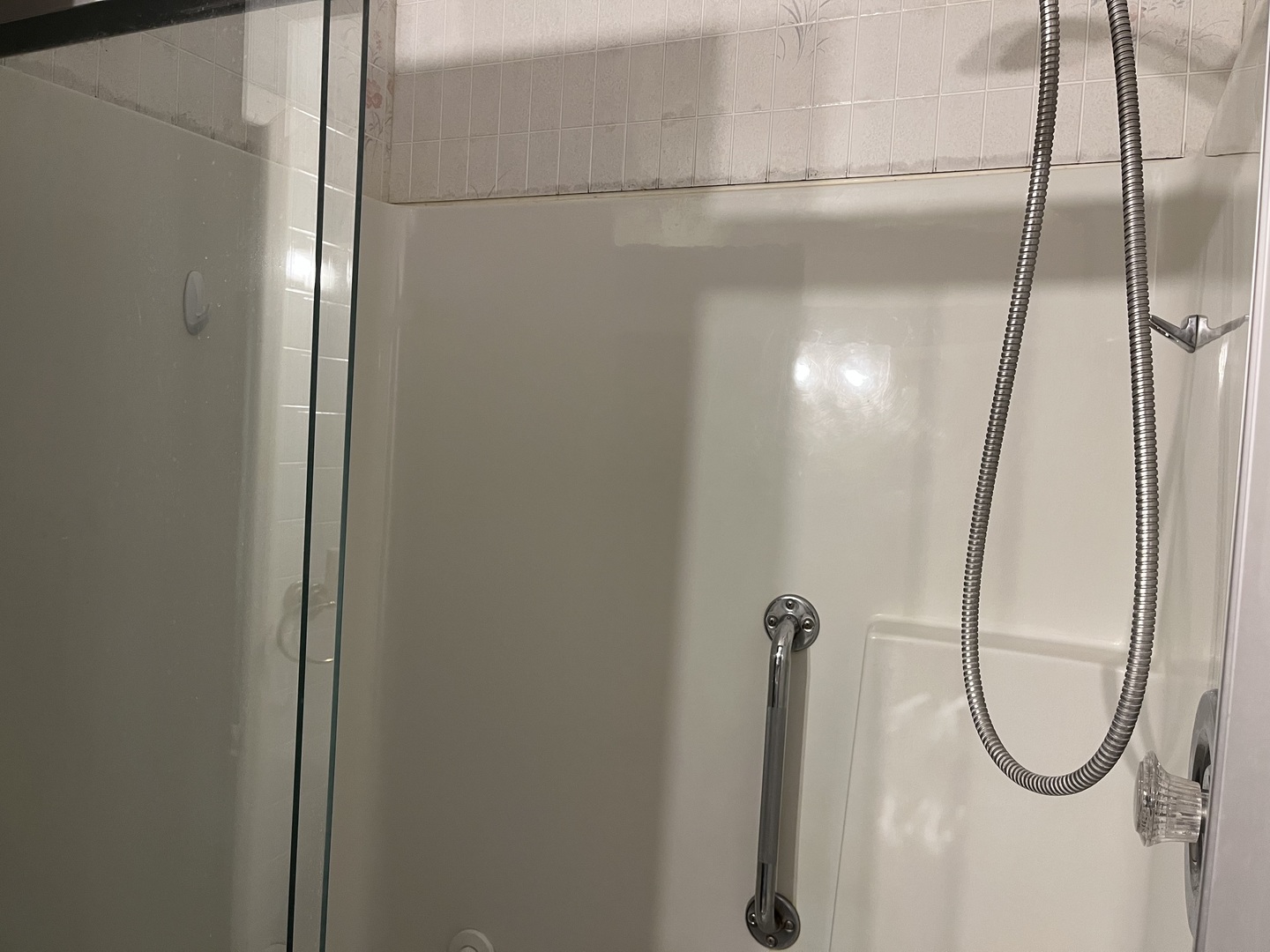 112 Chicago Road, Unit 1 Oswego, IL 60543 - Photo 19 of 29 a bathroom with a glass shower door