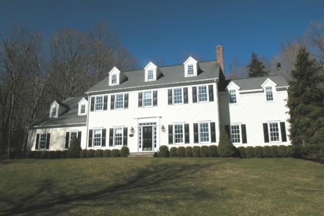 155 Limekiln Road Ridgefield, CT 06877 - Photo 1 of 1 a front view of a house with a garden