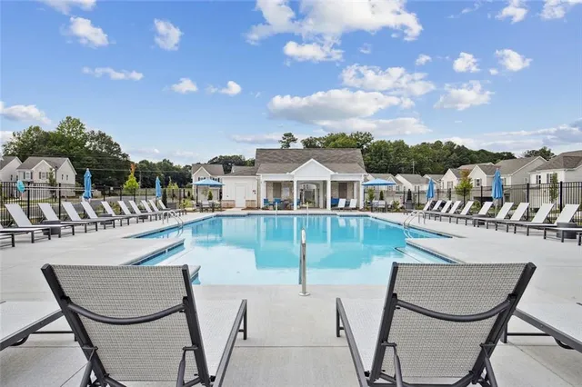 a view of a swimming pool with seating area