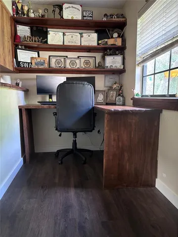 a living room with furniture and windows