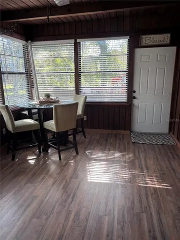 a spacious bedroom with a bed and a large window