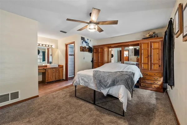 a bedroom with furniture and a window